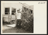 [recto] James Kobata, from Rohwer, returns to his flower nursery on 139th St., Gardena, California. His wife and children remain in ...