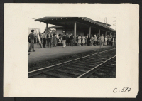 [recto] Woodland, Calif.--Families of Japanese ancestry have come in from the ranches this morning and are gathered at the railroad station ...