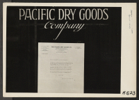 [recto] Letter of appreciation posted in show window of Pacific Dry Goods Company, 434-440 Grant Avenue, in San Francisco's Chinatown. Evacuees of Japanese descent will be housed in War Relocation Authority centers for the duration. ;  Photographer: Lange, Doro