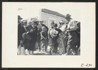 [recto] Turlock, Calif.--Families of Japanese ancestry arrived at Turlock assembly center. Evacuees will be housed later at War Relocation Authority centers for the duration. ;  Photographer: Lange, Dorothea ;  Turlock, California.