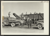 [recto] Coal loading machine in operation at Granada Relocation Center. ;  Photographer: McClelland, Joe ;  Amache, Colorado.