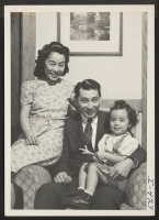 [recto] Shown in their apartment in Kansas City, Missouri, are May and Tats Kushida, with their daughter, Pamela, age 2-1/2. Employed ...