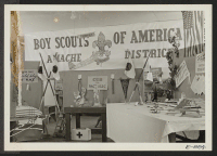 [recto] Exhibits of work done by the various boy scout troops at Granada. ;  Photographer: McClelland, Joe ;  Amache, Colorado.