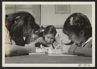 [recto] Pupils of the high first grade are shown busily at work on their geography lessons. ;  Photographer: Stewart, Francis ;  Topaz, Utah.