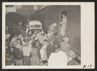 [recto] Los Angeles, Calif.-- Evacuees of Japanese ancestry entraining for Manzanar, Calif., 250 miles away, where they now are housed in a War Relocation Authority center. ;  Photographer: Albers, Clem ;  Los Angeles, California.