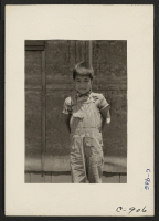 [recto] Manzanar, Calif.--An evacuee orphan, one of 65 now housed in the Children's Village at this War Relocation Authority center for evacuees of Japanese ancestry. ;  Photographer: Lange, Dorothea ;  Manzanar, California.