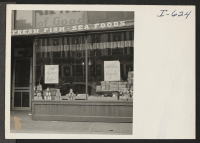 [recto] The store front of the Toguri Food Shop at 1012 North Clark Street, Chicago, Illinois. This store handles a full ...