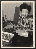 [recto] Miss Tatsuko Shinno relocated to Des Moines from Jerome Relocation Center in January, 1944. Miss Shinno has made quite a ...