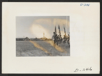 [recto] A view of the flag display which was part of the Labor Day celebration at this relocation center. ;  Photographer: Stewart, Francis ;  Newell, California.