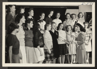 [recto] Mrs. Ryozo Muto prepares to lead her Sunday School class in some songs. In February, 1941, Mrs. Muto bid her ...
