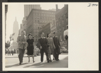 [recto] Strolling up New York City's famous Fifth Avenue on a mid-summer Saturday afternoon are four young resettlers. They are, from ...