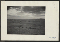 [recto] Looking east over the relocation center from reservoir hill. ;  Photographer: Parker, Tom ;  Heart Mountain, Wyoming.
