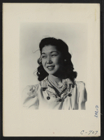 [recto] Manzanar, Calif.--Shizuco Setoguchi is now assisting on the local newspaper, the Manzanar Free Press, at this War Relocation Authority center for evacuees of Japanese ancestry. Former occupation: Secretary. ;  Photographer: Lange, Dorothea ;  Manzanar