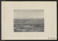 [recto] Manzanar, Calif.--View of construction of water reservoir at Manzanar, a War Relocation Authority center where evacuees of Japanese ancestry will be housed for the duration. ;  Photographer: Stewart, Francis ;  Manzanar, California.