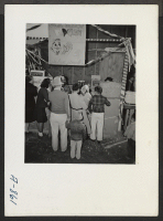 [recto] New Year's Fair. Popcorn stand run by Girl Scouts. ;  Photographer: Stewart, Francis ;  Poston, Arizona.