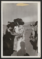 [recto] Newest profession--evacuees get autograph of Sachiko Miu[?] who is relocating. ;  Photographer: Cook, John D. ;  Newell, California.