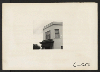 [recto] Sacramento, Calif.--Japanese bank and Medical-Dental Building in business district of the Japanese quarter two days before evacuation. ;  Photographer: Lange, Dorothea ;  Sacramento, California.