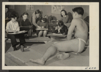 [recto] Benji Okuda instructing a life class, an adult night school group at the Heart Mountain Relocation Center. ;  Photographer: Parker, Tom ;  Heart Mountain, Wyoming.