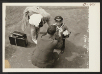[recto] Preliminary medical examination for mother and son before entering Santa Anita Park assembly center for evacuees of Japanese ancestry. Evacuees are transferred later to War Relocation Authority centers for the duration. ;  Photographer: Albers, Clem