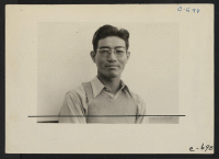 [recto] Manzanar, Calif.--Henry Ishizuka, graduate of U.C.L.A., now superintendent of the camouflage project which at this date employed approximately 500 workers ...