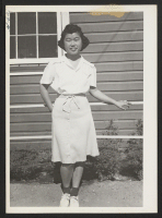 [recto] Katsumi Ogawa, first and only person to enlist from this center in Army Nurse Corps, August 28, 1943. ;  Photographer: Cook, John D. ;  Newell, California.