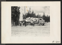 [recto] Salinas, Calif.--Baggage belonging to evacuees of Japanese ancestry is brought in by truck to this assembly center. Evacuees will later be transferred to War Relocation Authority centers for the duration. ;  Photographer: Albers, Clem ;  Salinas, Cali