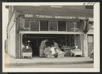 [recto] The New Takaki Grocery at 3550 S. Normadie, Los Angeles, opened by George Takaki, Nisei, and his father Yoshihiro, Issei. ...