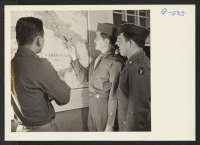 [recto] Sgt. Isamu Sanemitsu points out to Lt. Shigeru Tsubota and Pvt. Noboru Hashiro where he was serving in Italy. All ...