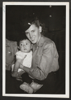 [recto] Army nurse tends segregee baby. ;  Newell, California.