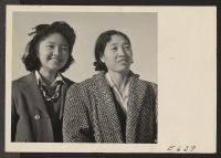 [recto] Helen Hifumi and her mother, Mrs. Ohiyo Hifumi, formerly of Los Angeles. ;  Photographer: Parker, Tom ;  Heart Mountain, Wyoming.