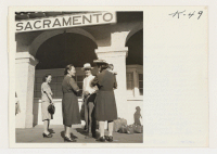 [recto] Returnees from the Rohwer Relocation Center awaiting transportation to their homes in Sacramento. Roaring into Sacramento Monday morning, July 30, ...