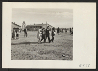 [recto] A typical recess scene on the temporary school grounds. ;  Photographer: Parker, Tom ;  Amache, Colorado.