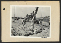 [recto] Poston, Ariz.--Installing fire hydrants at this War Relocation authority center for evacuees of Japanese ancestry. ;  Photographer: Clark, Fred ;  Poston, Arizona.