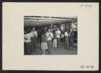 [recto] Manzanar, Calif.--Dancing class in a girls' recreation hall at Manzanar, a War Relocation Authority center where evacuees of Japanese ancestry will spend the duration. ;  Photographer: Stewart, Francis ;  Manzanar, California.