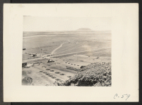 [recto] Tule Lake, Calif.-- A panoramic view showing site of Tule Lake War Relocation Authority center. (See also nos. C-56, C-57, and C-58 for complete panorama.) ;  Photographer: Albers, Clem ;  Newell, California.