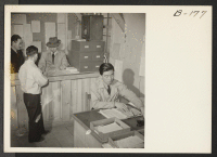 [recto] A complaint is filed, by a resident of this War Relocation Authority center, at the Warden's Office. ;  Photographer: Stewart, Francis ;  Newell, California.
