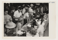 [recto] First arrivals at this relocation center are registering for housing. This first contingent consists of over 200 volunteer workers whose task was to prepare and organize the center for the arrival of its subsequent population. ;  Photographer: Parker, T