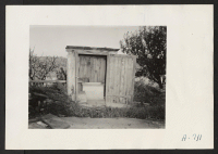[recto] Evacuee property. A Japanese bathhouse. Practically every farm, formerly operated by evacuees, has a similar type bathhouse. ;  Photographer: Stewart, Francis ;  Loomis, California.