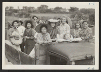 [recto] Girls from the Y.W.C.A. Summer Camp at Pueblo, Colorado, many of them evacuees of Japanese ancestry from the Relocation Center ...