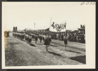 [recto] A parade was held by evacuees to celebrate Labor Day. Great originality in costuming was shown. ;  Photographer: Stewart, Francis ;  Newell, California.
