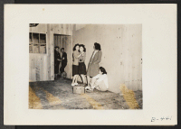 [recto] Arcadia, Calif.--Impromptu dancing at Santa Anita Park assembly center for evacuees of Japanese ancestry. Evacuees are transferred later to War Relocation Authority centers for the duration. ;  Photographer: Albers, Clem ;  Arcadia, California.