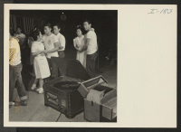 [recto] Closing of the Jerome Center, Denson, Arkansas. Young folks enjoy a final dance in one of the recreation halls before their departure to other centers. ;  Photographer: Iwasaki, Hikaru ;  Denson, Arkansas.