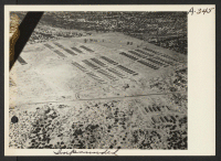[recto] Aerial view of Colorado River Relocation Center for persons of Japanese ancestry evacuated from the West Coast. ;  Photographer: Clark, Fred ;  Poston, Arizona.