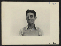 [recto] Manzanar, Calif.--Henry Ishizuka, graduate of U.C.L.A., now superintendent of the camouflage project which at this date employed approximately 500 workers ...