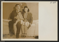 [recto] Mr. and Mrs. Robert Yoshio Kodama and their small son, Robert Kodama, Jr., residents of the Heart Mountain Relocation Center, ...