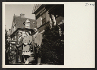 [recto] In front of their home on a tree-lined street in Philadelphia, Pennsylvania, Mr. and Mrs. Eishichiro George Koiwai, Issei formerly ...