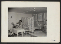 [recto] A typical interior of a barracks home. ;  Photographer: Parker, Tom ;  Denson, Arkansas.