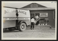 [recto] Scene at the entrance of the Heart Mountain Hospital as obstetrics case is brought in. ;  Photographer: Iwasaki, Hikaru ;  Heart Mountain, Wyoming.