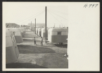 [recto] A section of the Winona Housing Project in Burbank, California, where returned evacuees are provided with temporary housing while they located permanent homes in and around Los Angeles. ;  Photographer: Mace, Charles E. ;  Burbank, California.