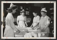[recto] Ella Ito (third from left) and her co-workers prepare plasma containers for the blood bank at New York's world famous ...